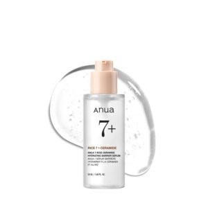 A high-quality studio shot of the clear Anua 7 Rice Ceramide Hydrating Barrier Serum bottle with a large, clear droplet of the serum's texture in the background.