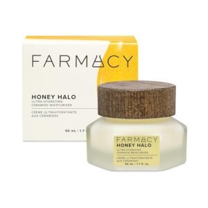 A studio shot of a jar of Farmacy Honey Halo Ultra-Hydrating Ceramide Moisturizer (50ml) standing in front of its yellow and white product box.